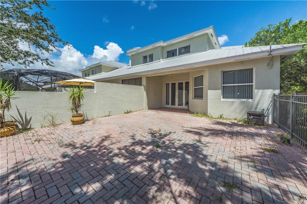1855 Bridgepointe Circle, Unit 21 Vero Beach, FL 32967 - Photo 30 of 35 a view of a house with a snow in the yard