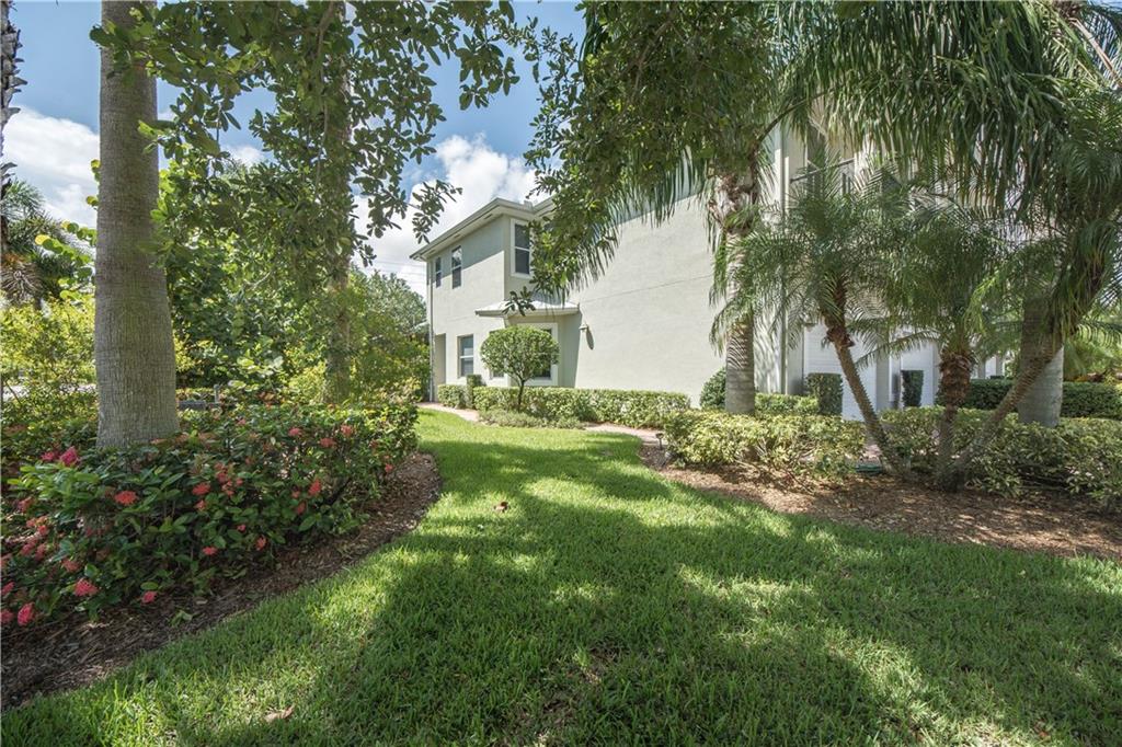 1855 Bridgepointe Circle, Unit 21 Vero Beach, FL 32967 - Photo 4 of 35 a view of a backyard