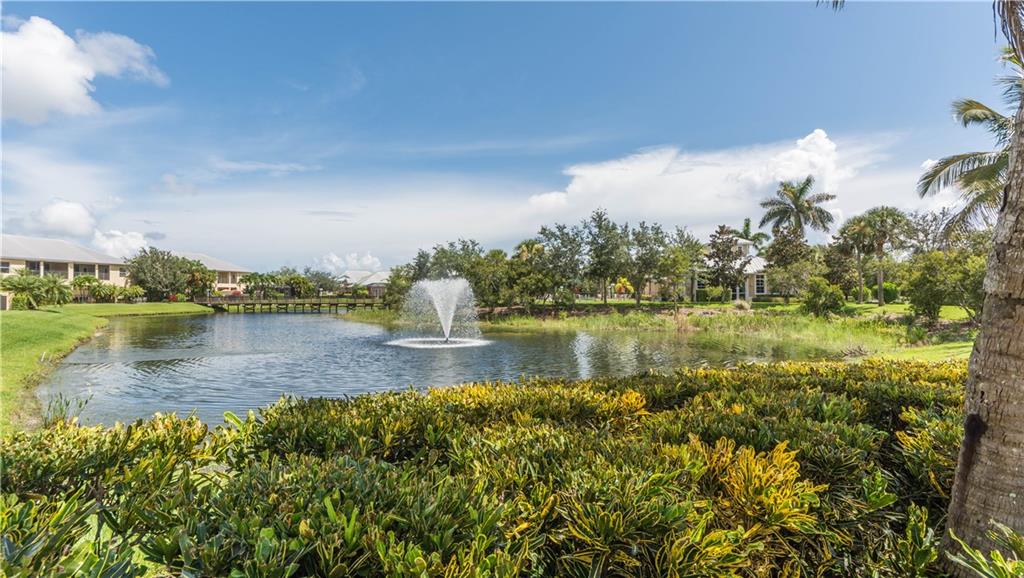 1855 Bridgepointe Circle, Unit 21 Vero Beach, FL 32967 - Photo 32 of 35 a view of lake with green space