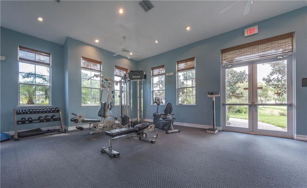 1855 Bridgepointe Circle, Unit 21 Vero Beach, FL 32967 - Photo 34 of 35 a view of a room with gym equipment
