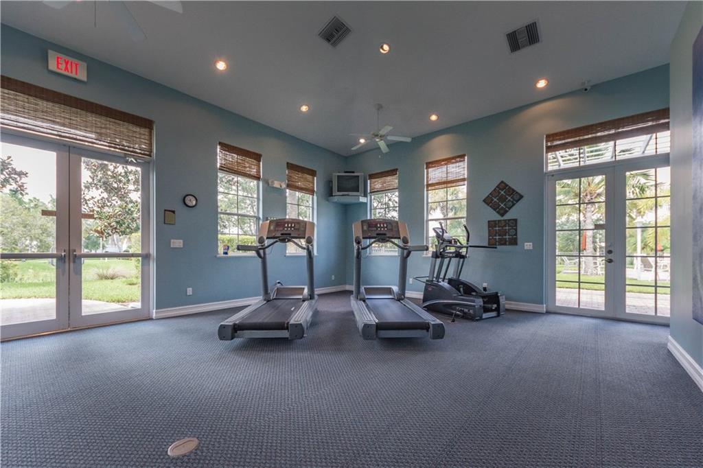 1855 Bridgepointe Circle, Unit 21 Vero Beach, FL 32967 - Photo 35 of 35 a view of a room with gym equipment