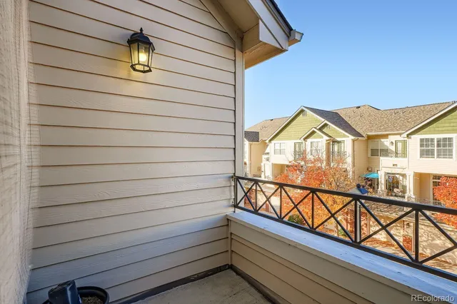 a view of a house with wooden deck