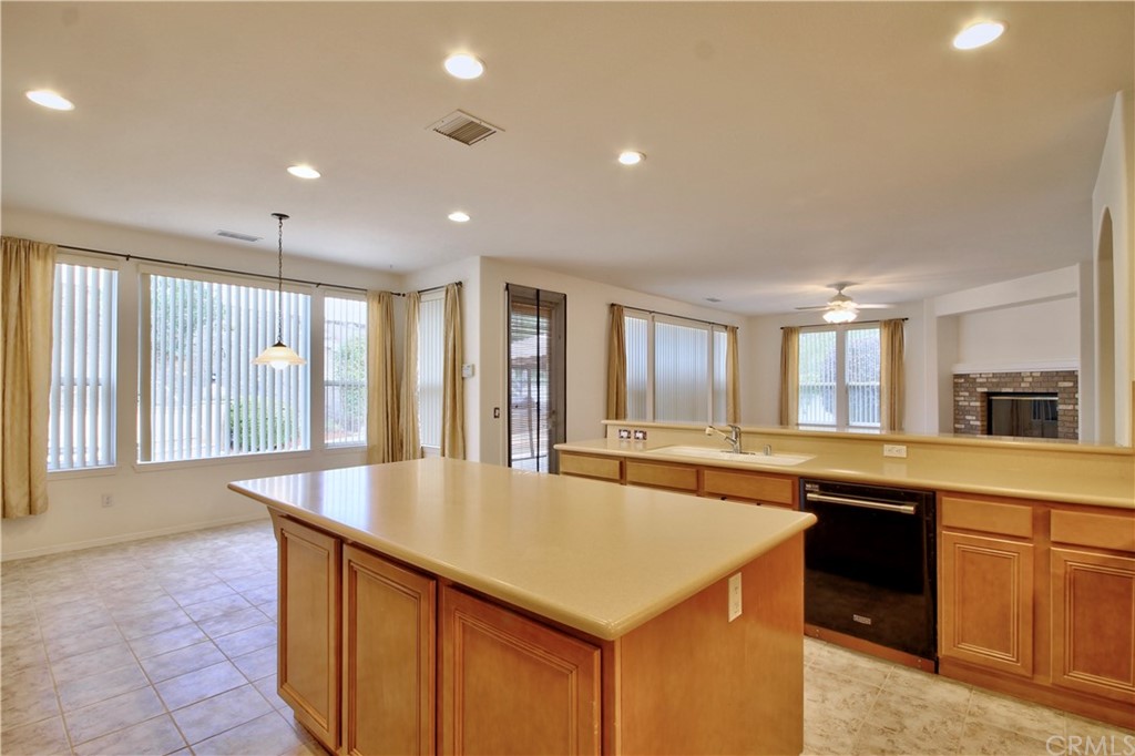 30099 Corte Coelho Temecula, CA 92591 - Photo 16 of 47 a large kitchen with kitchen island a sink counter space and stainless steel appliances