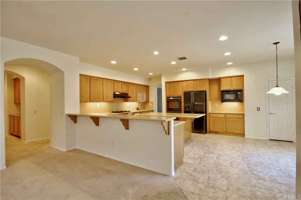30099 Corte Coelho Temecula, CA 92591 - Photo 20 of 47 a kitchen with a sink stainless steel appliances and cabinets