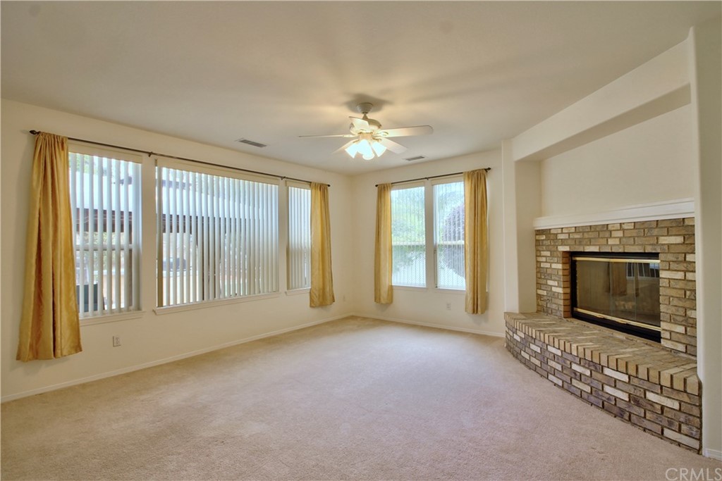30099 Corte Coelho Temecula, CA 92591 - Photo 21 of 47 a view of an empty room with a fireplace and a window