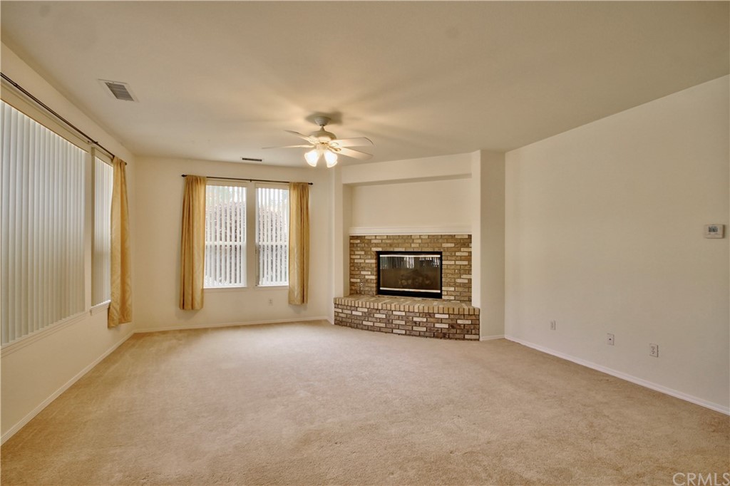 30099 Corte Coelho Temecula, CA 92591 - Photo 22 of 47 a view of an empty room with a fireplace and a window
