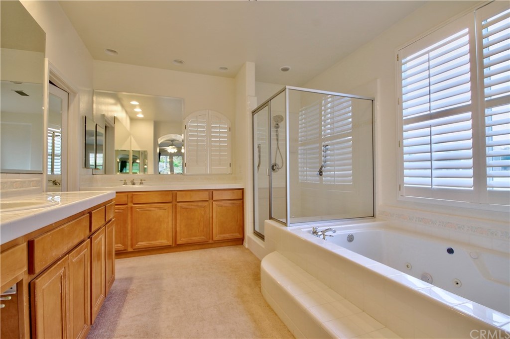 30099 Corte Coelho Temecula, CA 92591 - Photo 24 of 47 a large bathroom with a large tub and double vanity