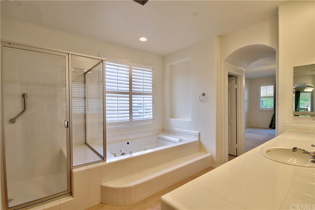 30099 Corte Coelho Temecula, CA 92591 - Photo 25 of 47 a spacious bathroom with a tub shower and sink