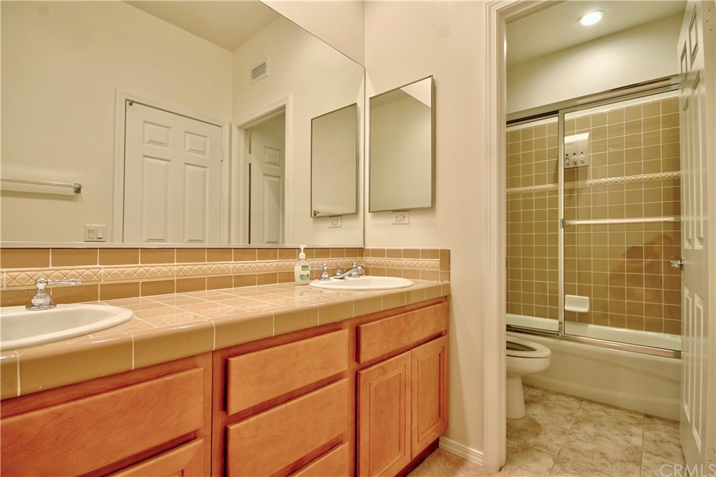 30099 Corte Coelho Temecula, CA 92591 - Photo 29 of 47 a bathroom with a sink and a mirror