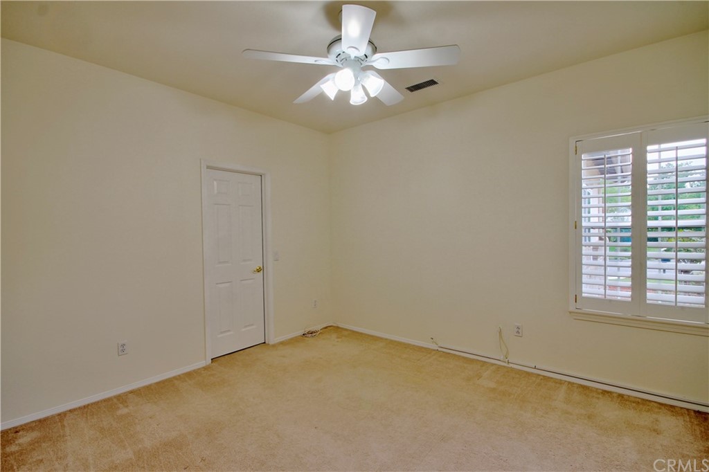 30099 Corte Coelho Temecula, CA 92591 - Photo 30 of 47 an empty room with a chandelier fan and windows