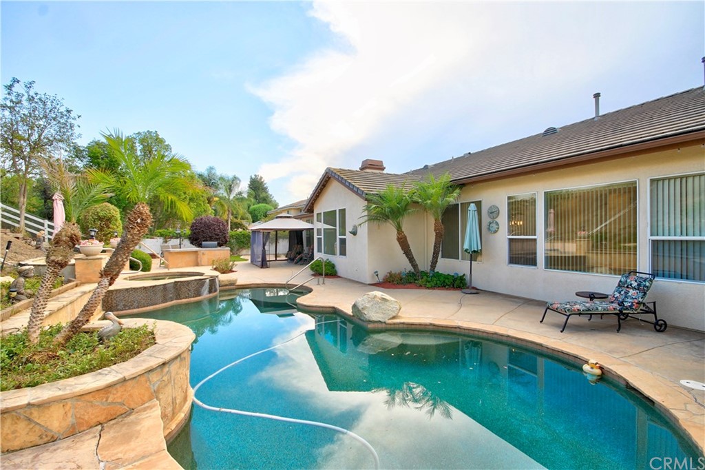 30099 Corte Coelho Temecula, CA 92591 - Photo 35 of 47 a swimming pool with outdoor seating and yard