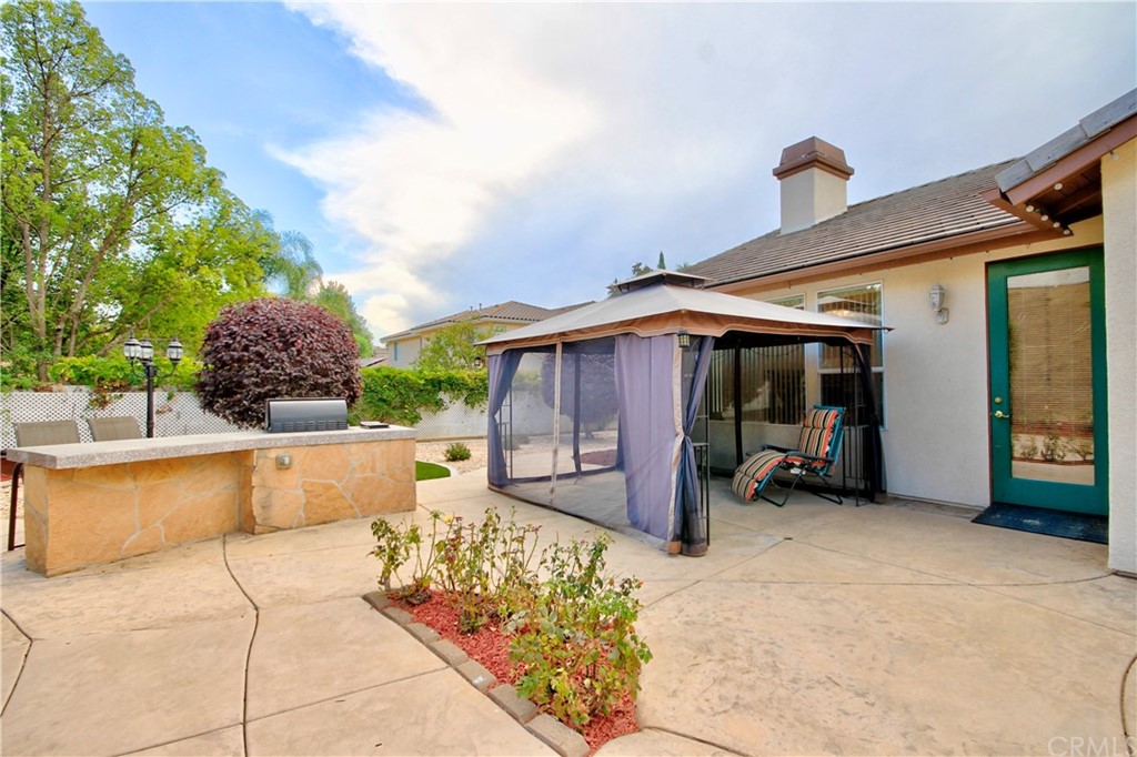 30099 Corte Coelho Temecula, CA 92591 - Photo 38 of 47 a view of a backyard with sitting area and furniture