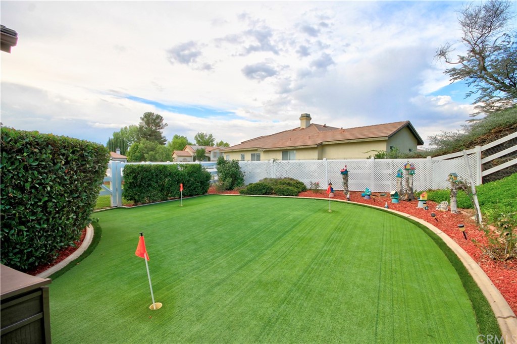 30099 Corte Coelho Temecula, CA 92591 - Photo 40 of 47 a view of a backyard with plants and a garden
