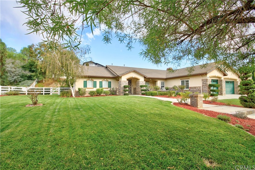 30099 Corte Coelho Temecula, CA 92591 - Photo 6 of 47 a view of a house with a big yard and sitting area