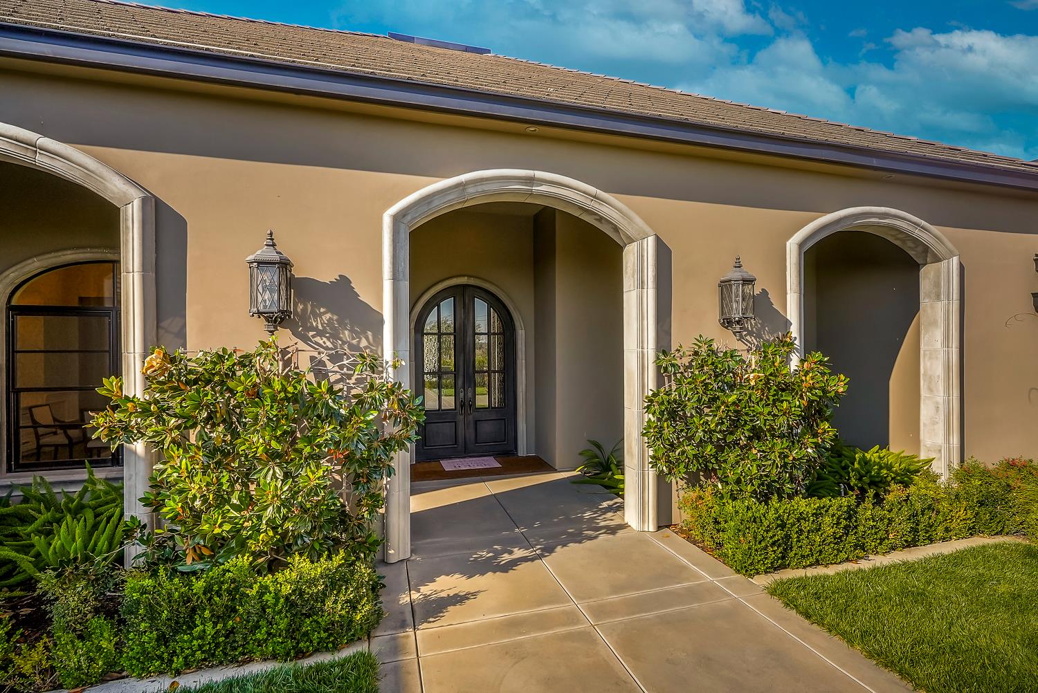 22215 Devries Road Lodi, CA 95242 - Photo 15 of 99 a front view of a house with garden