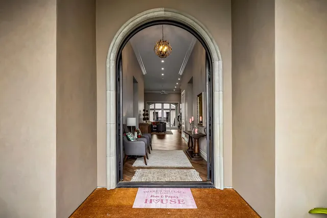 a kitchen with stainless steel appliances kitchen island granite countertop a refrigerator and cabinets
