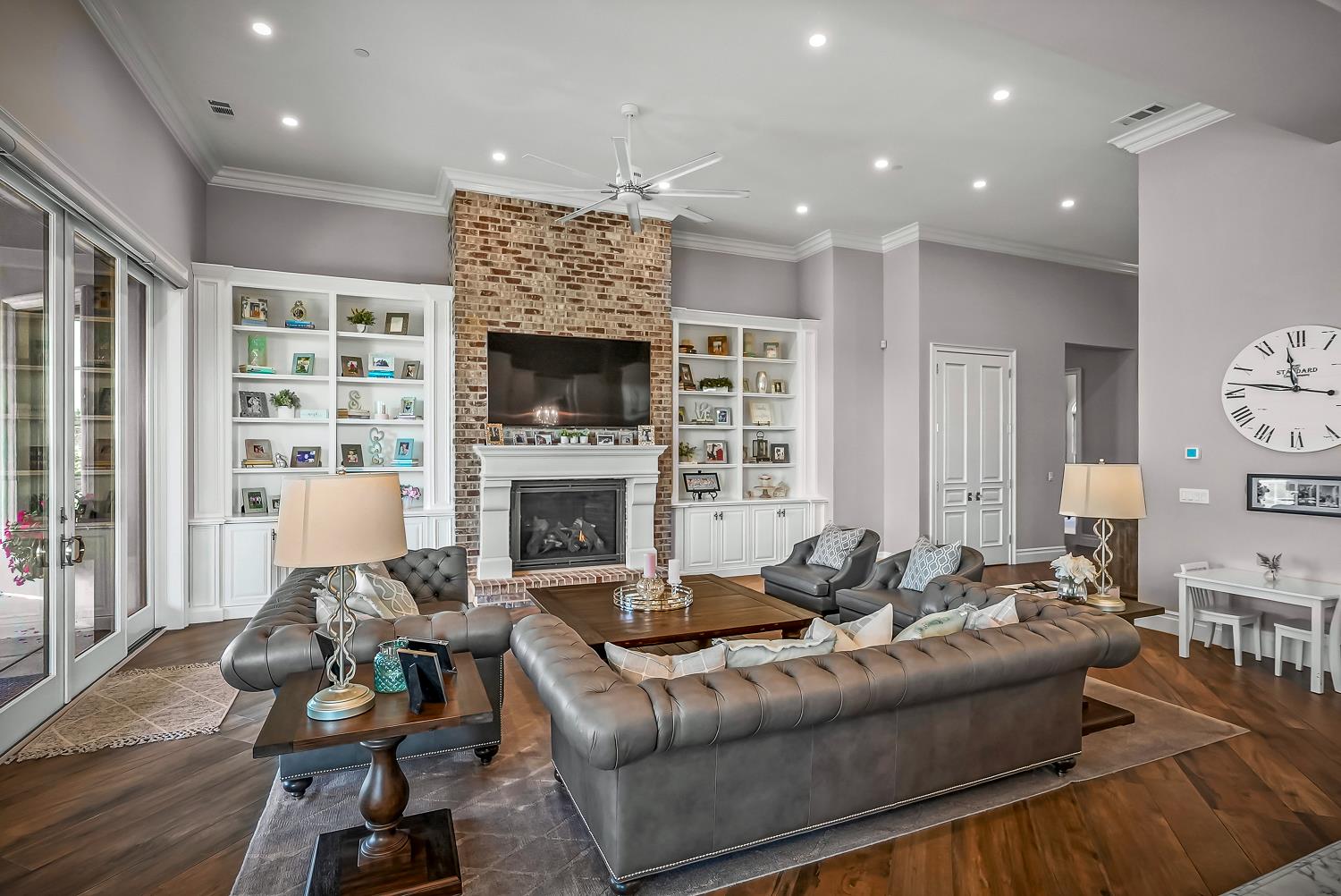 22215 Devries Road Lodi, CA 95242 - Photo 23 of 99 a living room with furniture and a fireplace