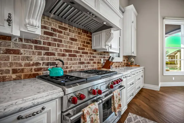 a living room with a fireplace and a flat screen tv