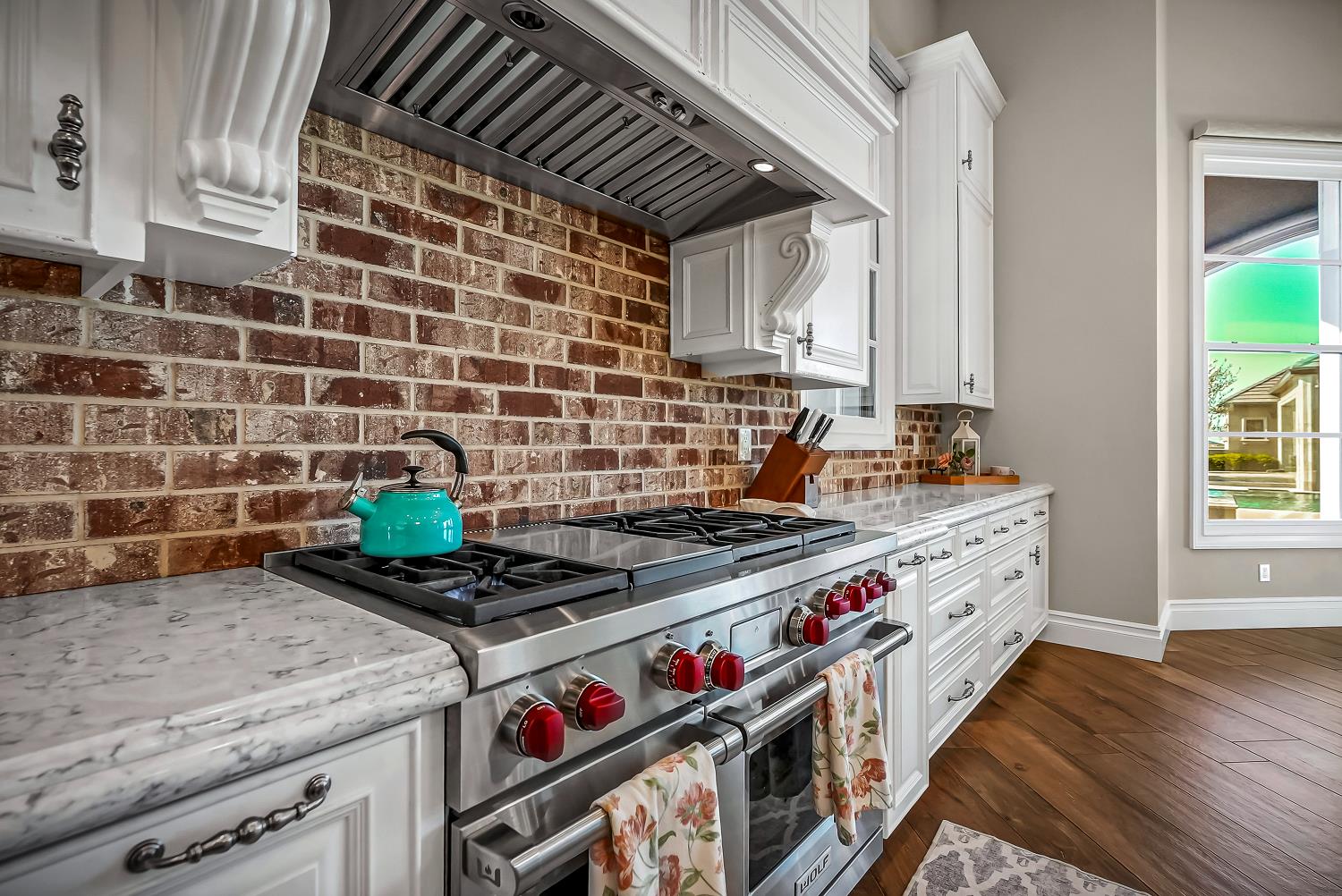 22215 Devries Road Lodi, CA 95242 - Photo 29 of 99 a kitchen with stove and cabinets