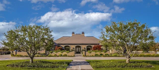 a front view of a house with swimming pool