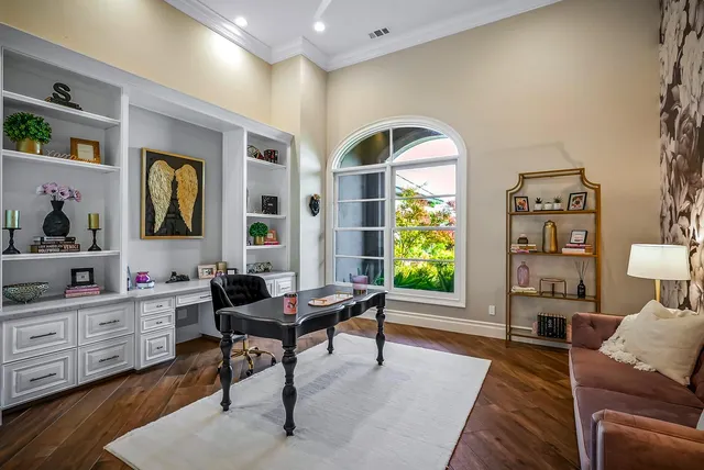 a view of a house with outdoor seating space