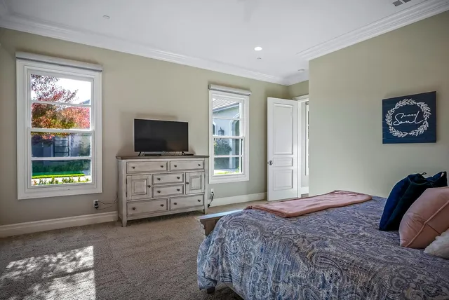 a kitchen with stainless steel appliances a sink a stove a refrigerator cabinets and a counter top space