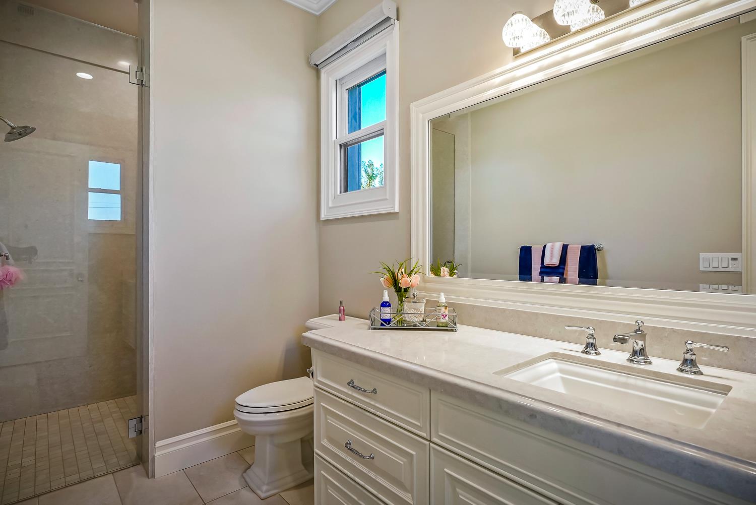 22215 Devries Road Lodi, CA 95242 - Photo 48 of 99 a bathroom with a granite countertop toilet sink and mirror