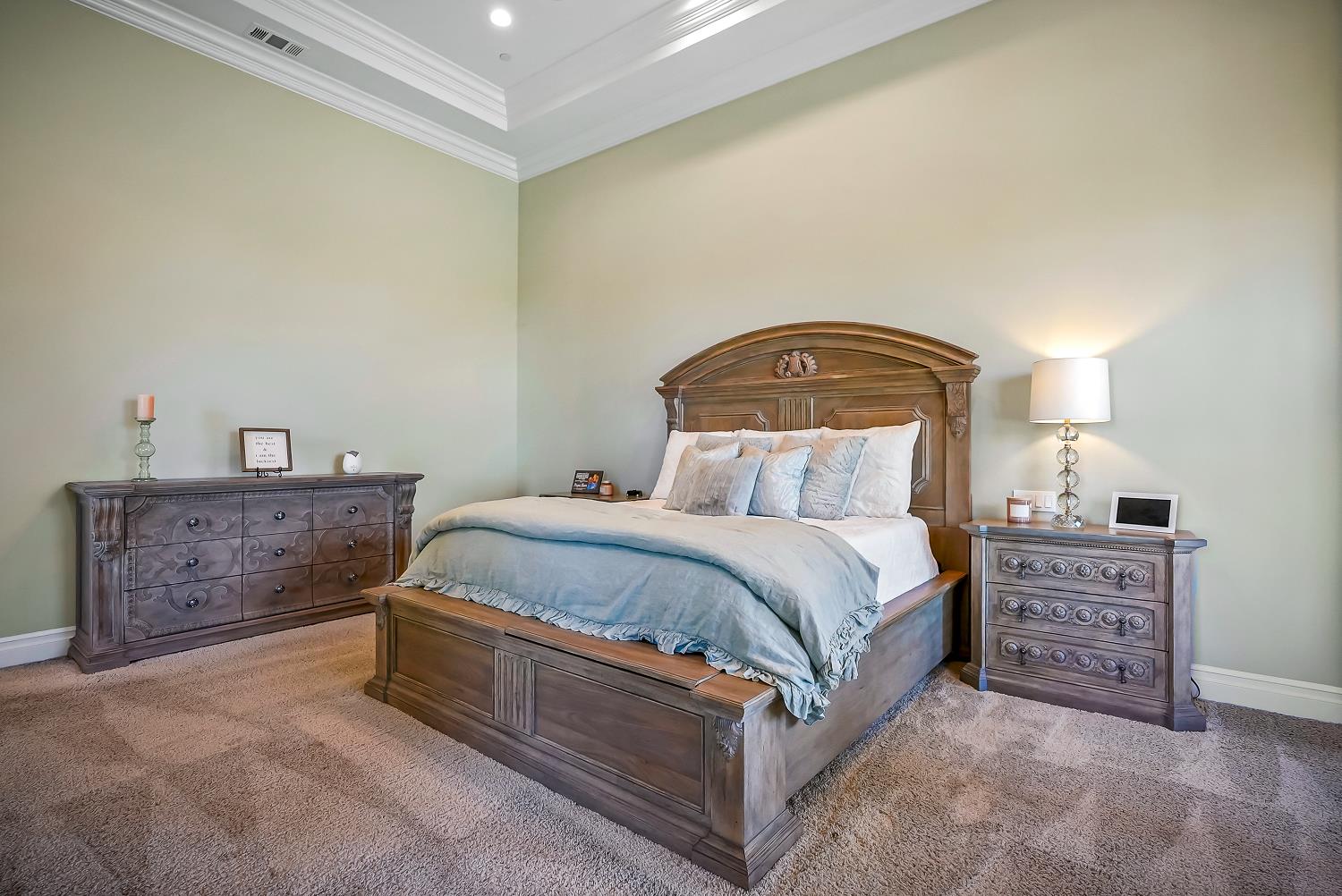 22215 Devries Road Lodi, CA 95242 - Photo 51 of 99 a spacious bedroom with a bed and dresser