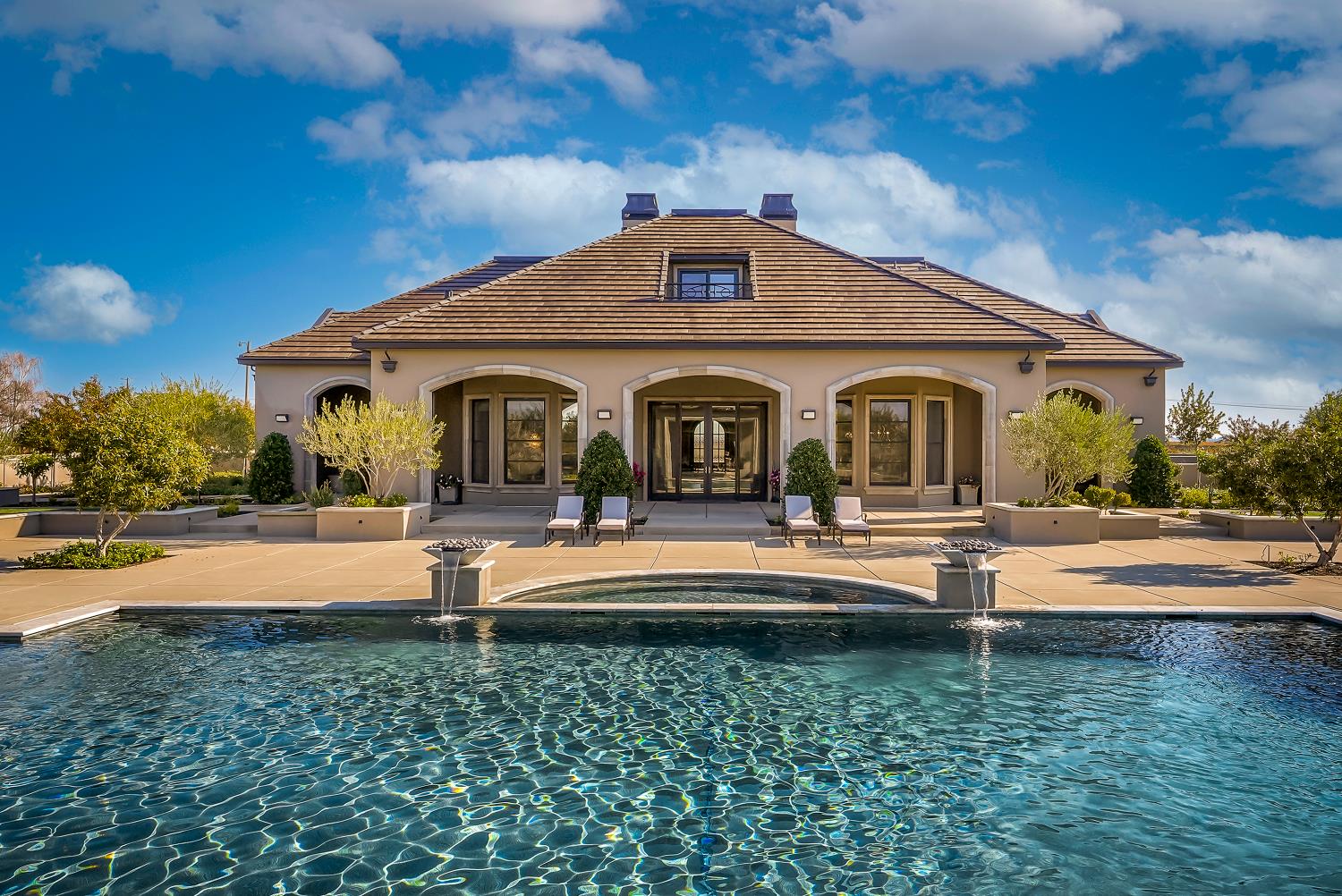 22215 Devries Road Lodi, CA 95242 - Photo 6 of 99 a front view of a house with swimming pool