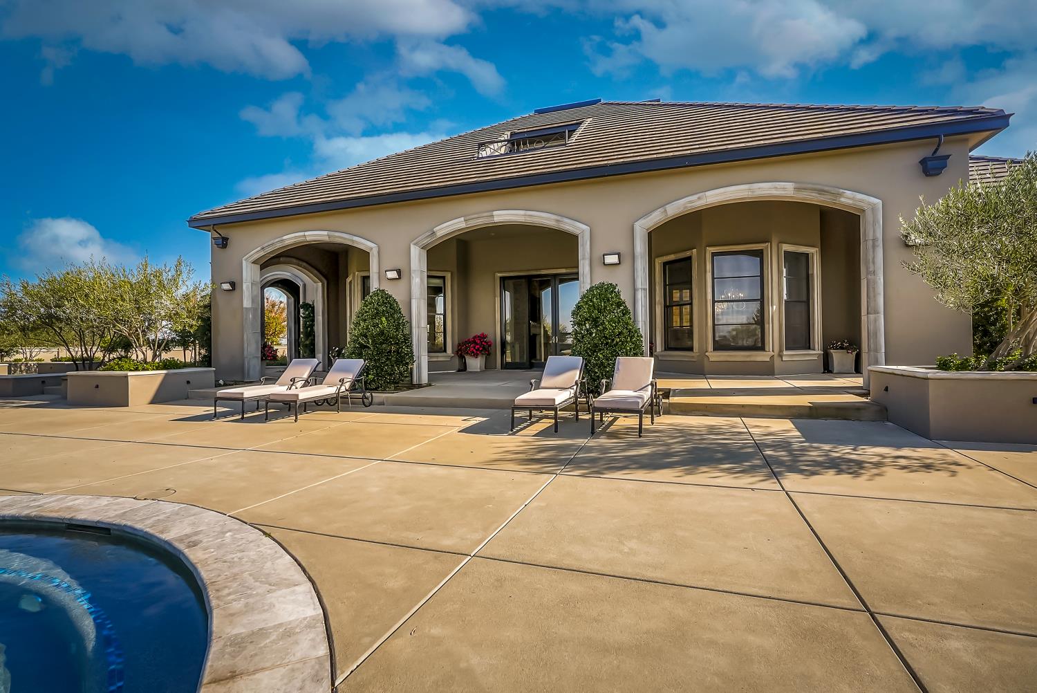 22215 Devries Road Lodi, CA 95242 - Photo 88 of 99 a view of a house with outdoor seating