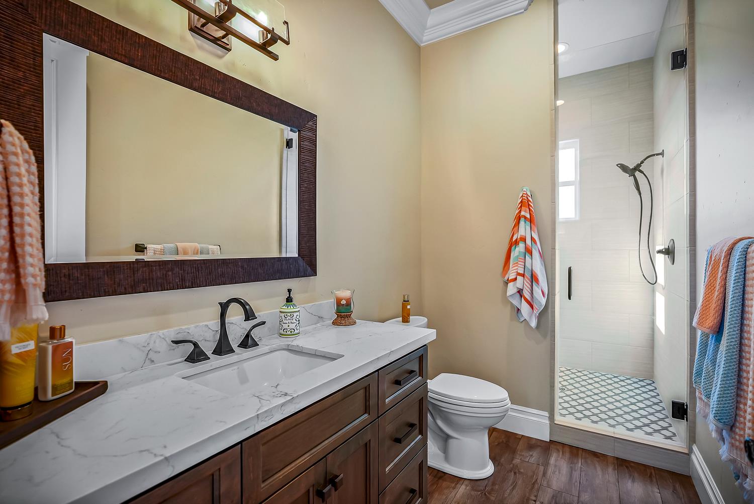 22215 Devries Road Lodi, CA 95242 - Photo 99 of 99 a bathroom with a granite countertop sink toilet and a mirror