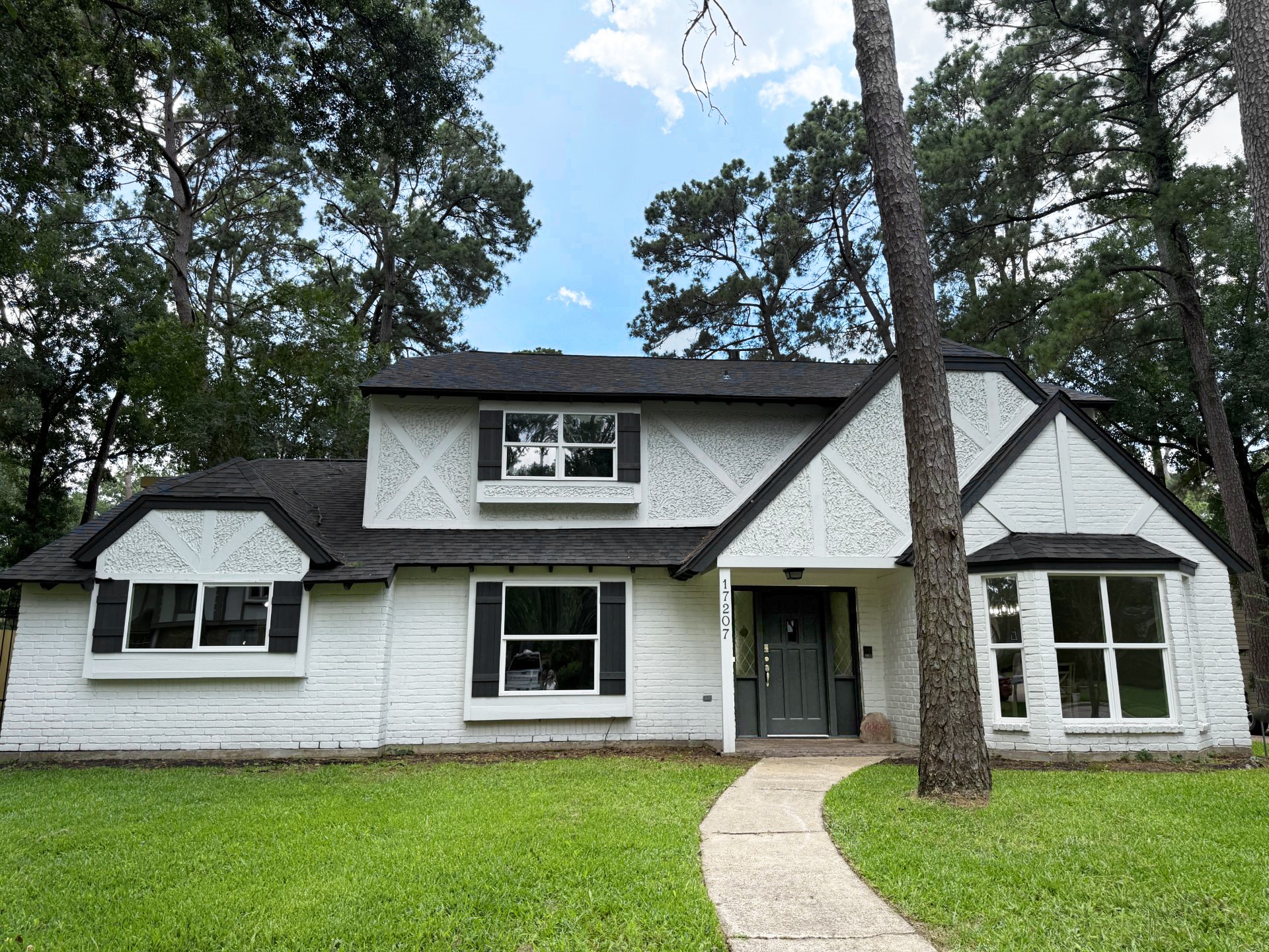 17207 Hill View Lane Spring, TX 77379 - Photo 2 of 34 a front view of a house with a yard