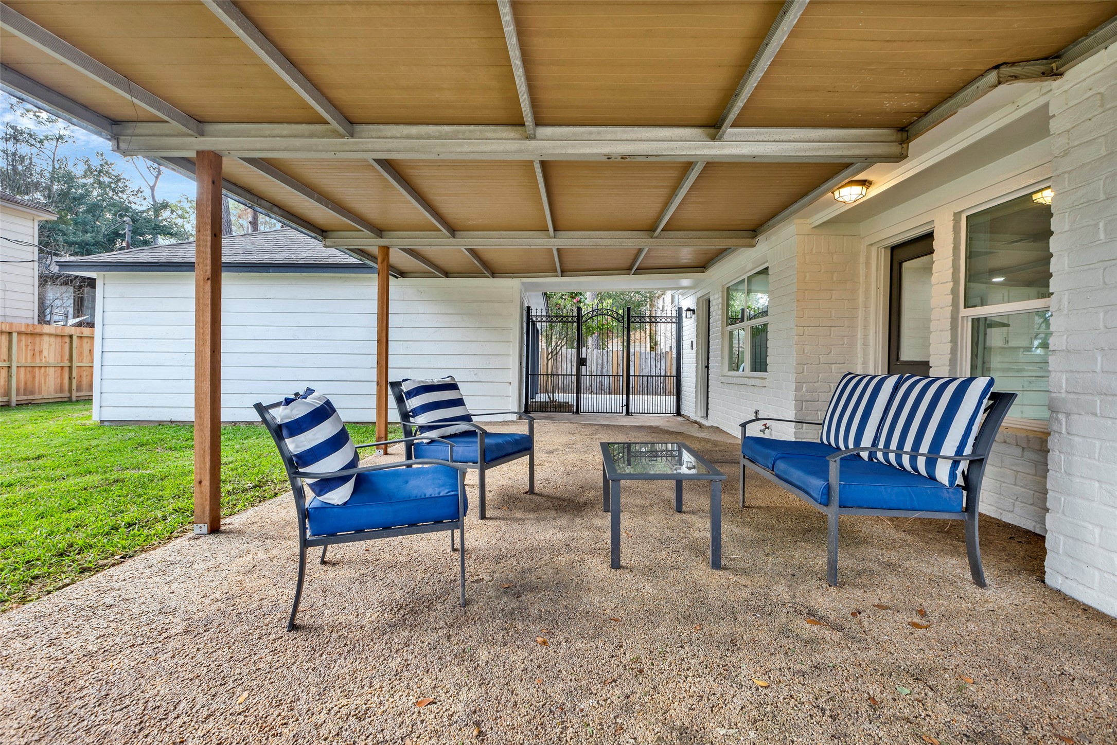 17207 Hill View Lane Spring, TX 77379 - Photo 24 of 34 a view of a chair and table in backyard of the house