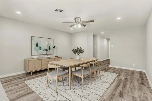 a dining room with furniture and window