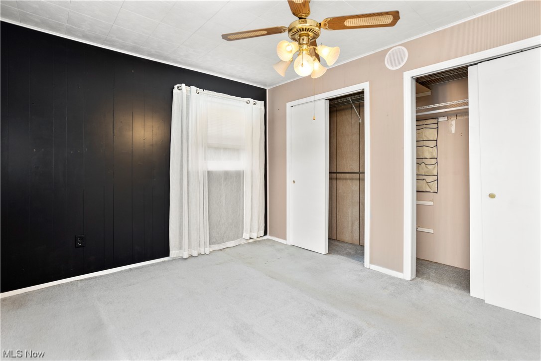 387 Fairfax Road Vermilion, OH 44089 - Photo 22 of 35 Bedroom with light carpet and ceiling fan