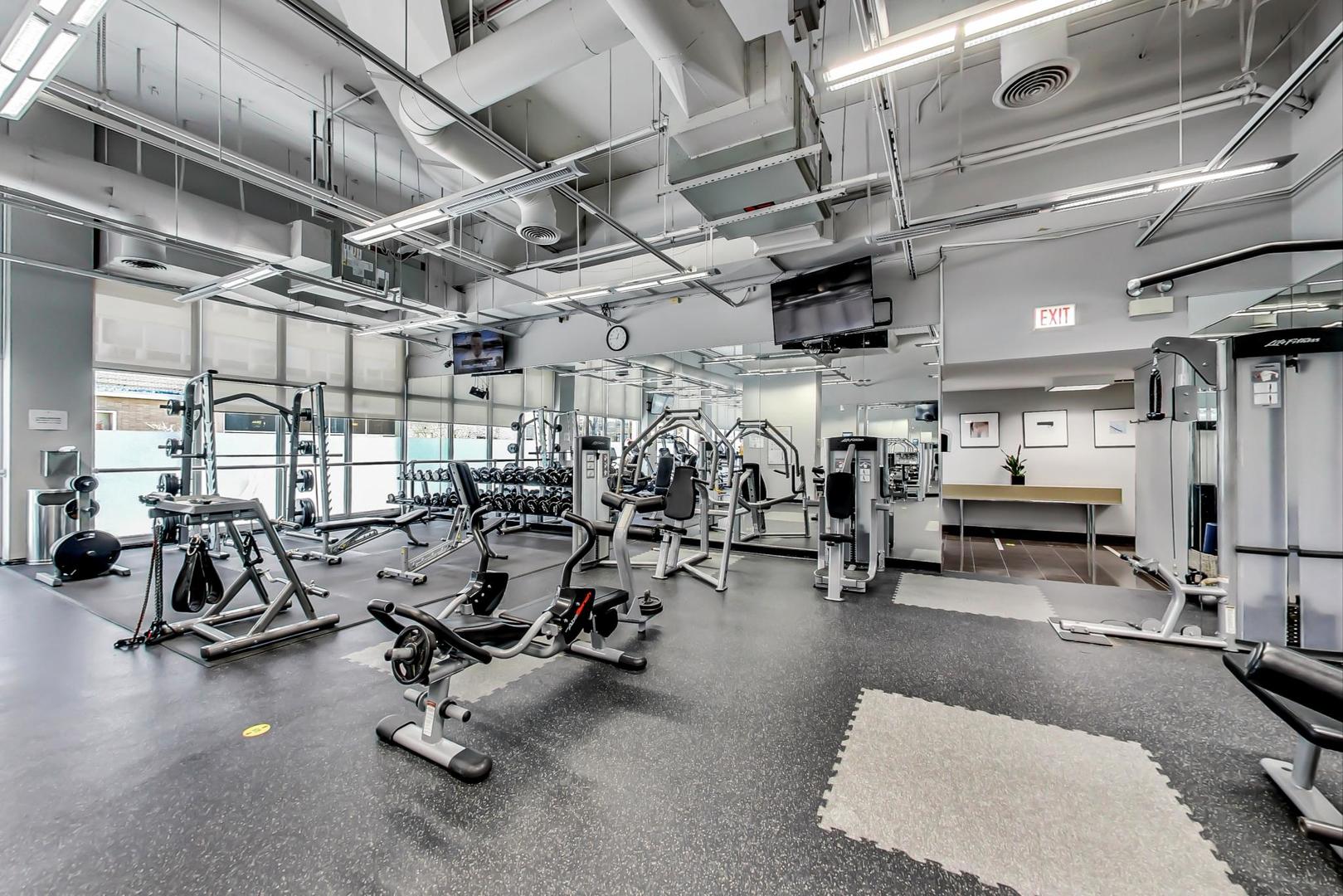 655 West Irving Park Road, Unit 2108 Chicago, IL 60613 - Photo 23 of 34 a view of a room with gym equipment