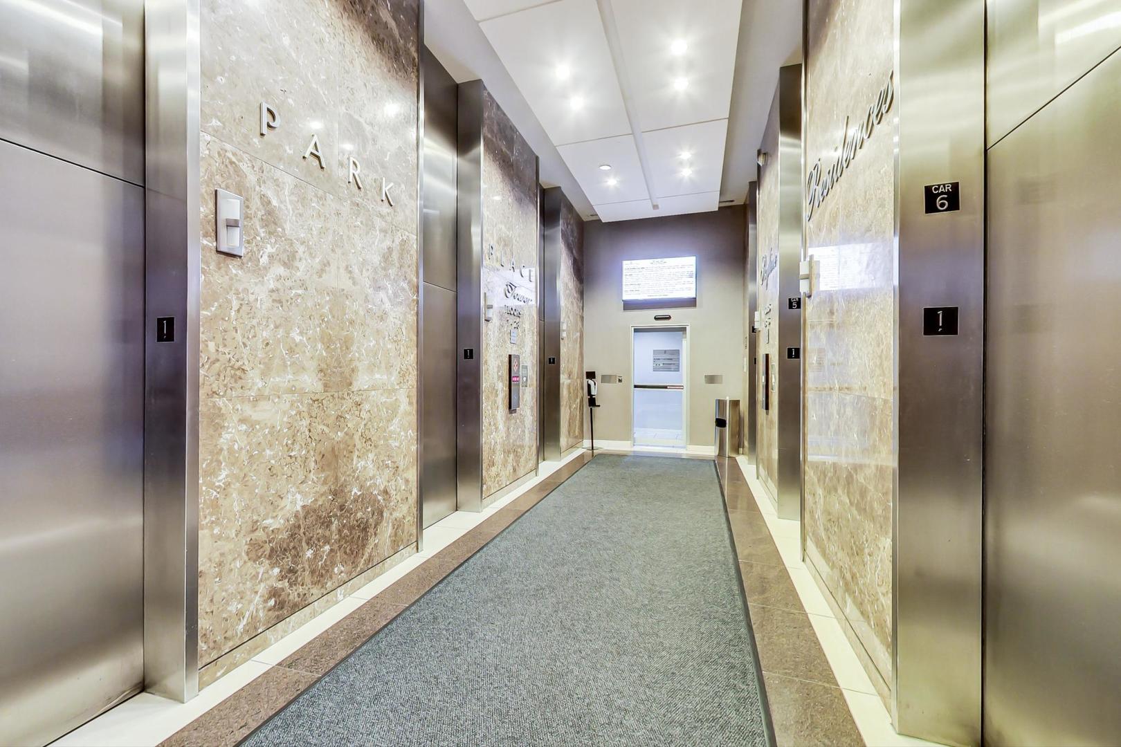 655 West Irving Park Road, Unit 2108 Chicago, IL 60613 - Photo 6 of 34 a view of a hallway with a elevator