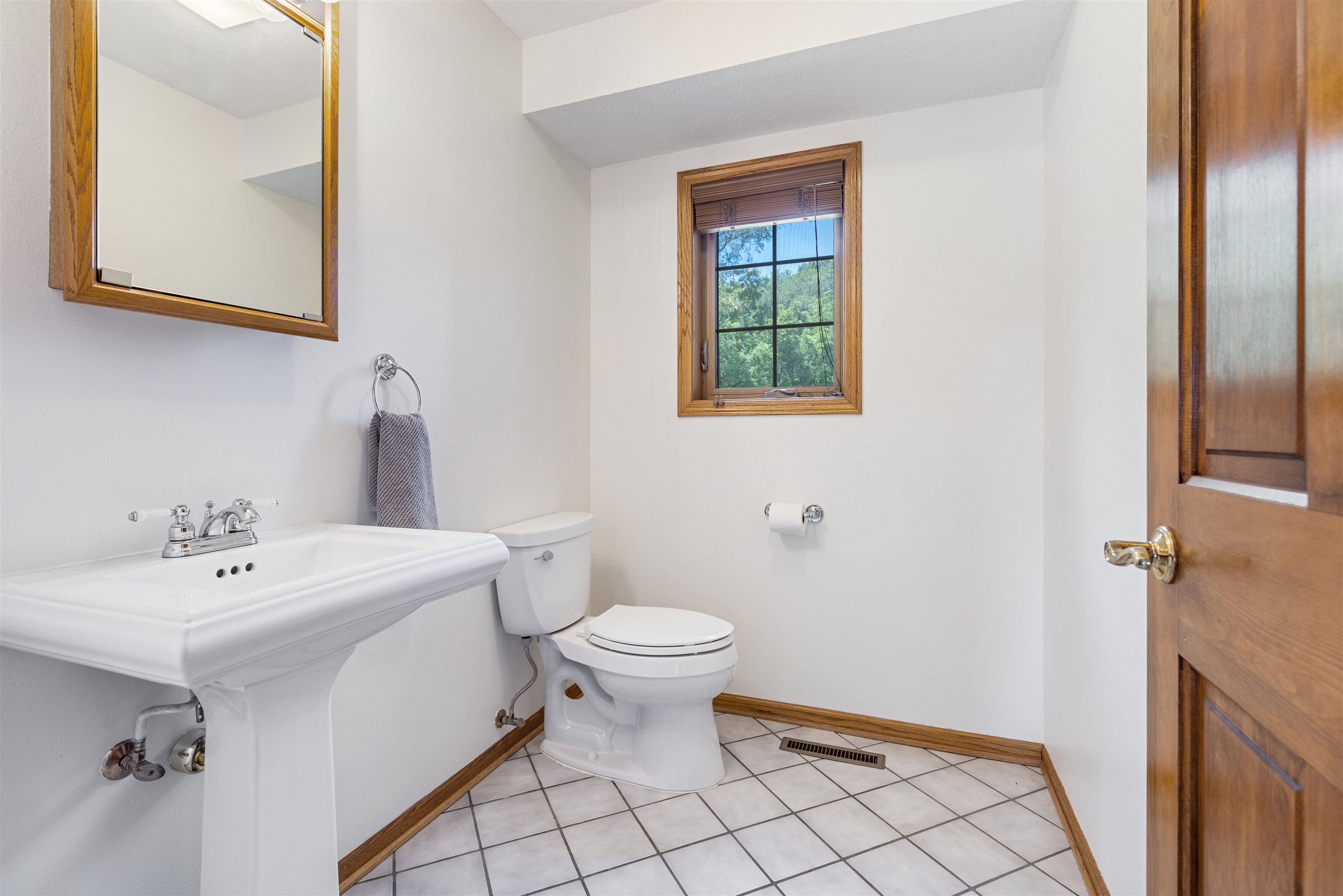 11136 Moate Road Durand, IL 61024 - Photo 16 of 55 a bathroom with a sink a toilet and a mirror