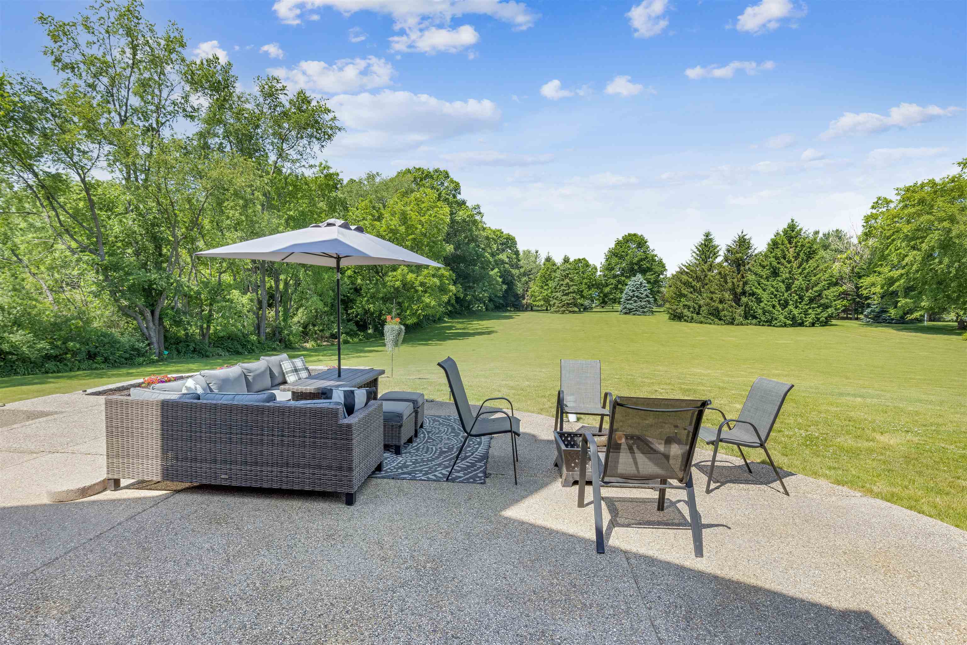11136 Moate Road Durand, IL 61024 - Photo 42 of 55 an outdoor space with furniture and umbrella
