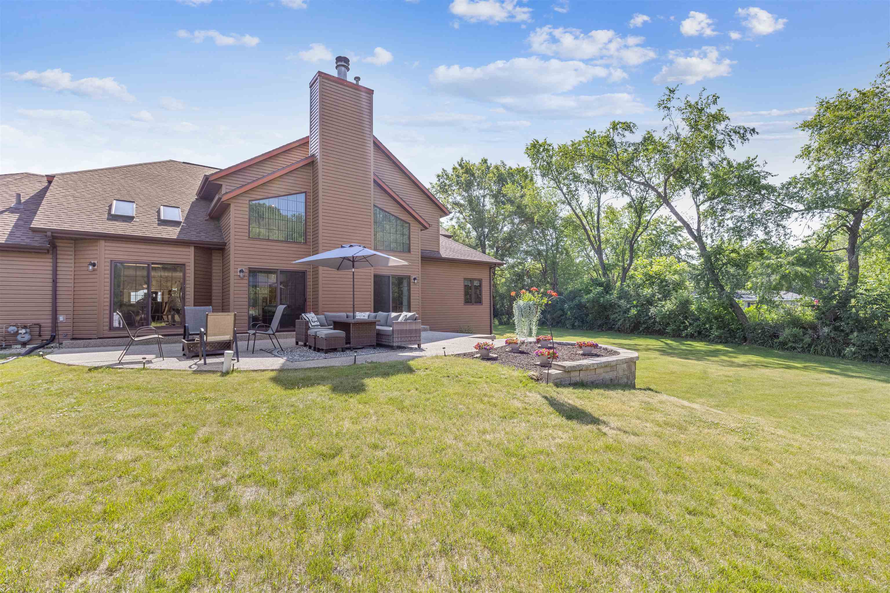 11136 Moate Road Durand, IL 61024 - Photo 44 of 55 a view of a house with swimming pool and sitting area