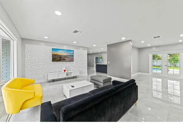 a living room with a couch and a flat screen tv