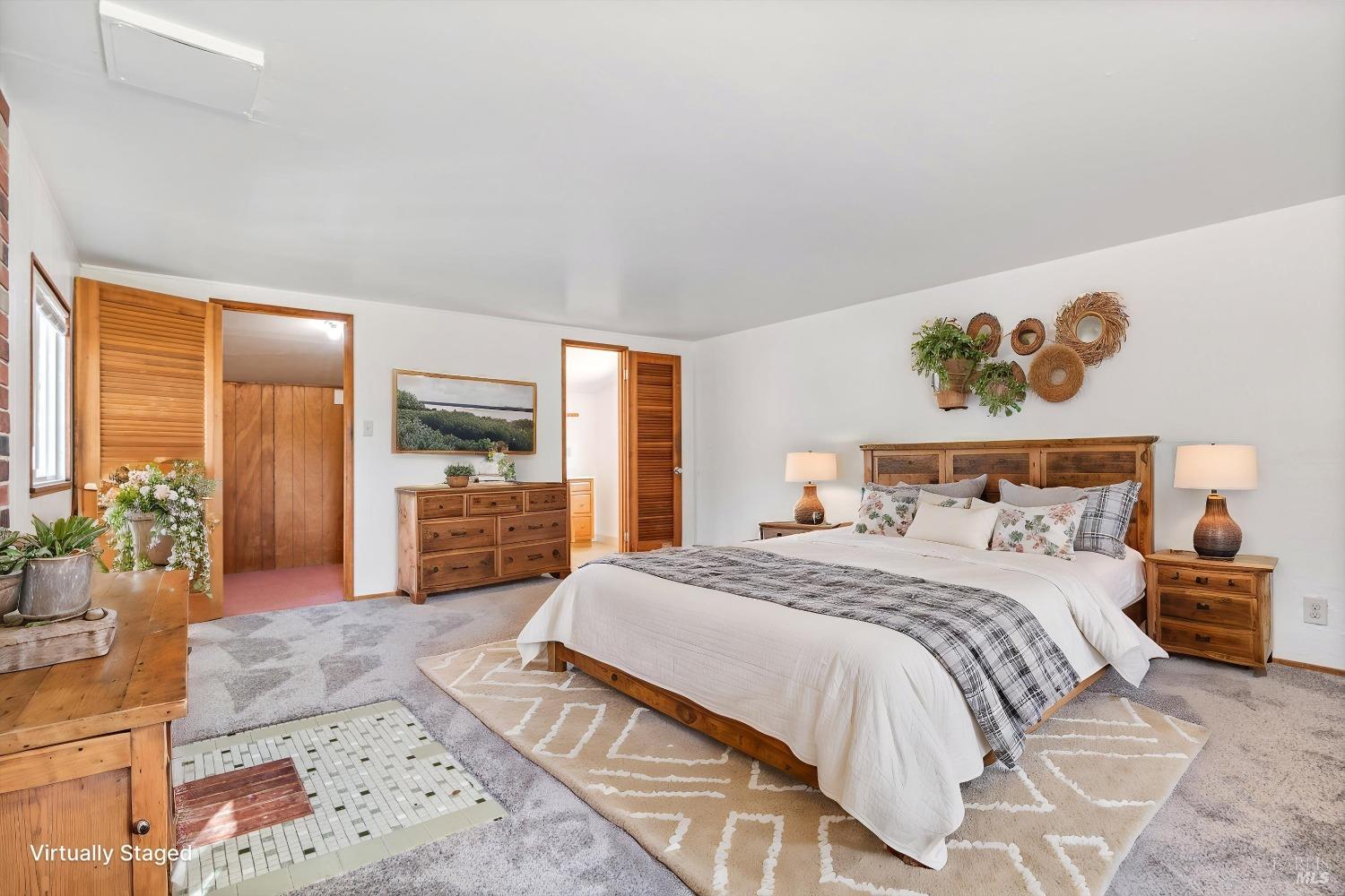 161 Cherry Street Ukiah, CA 95482 - Photo 15 of 39 a spacious bedroom with a large bed and a couch