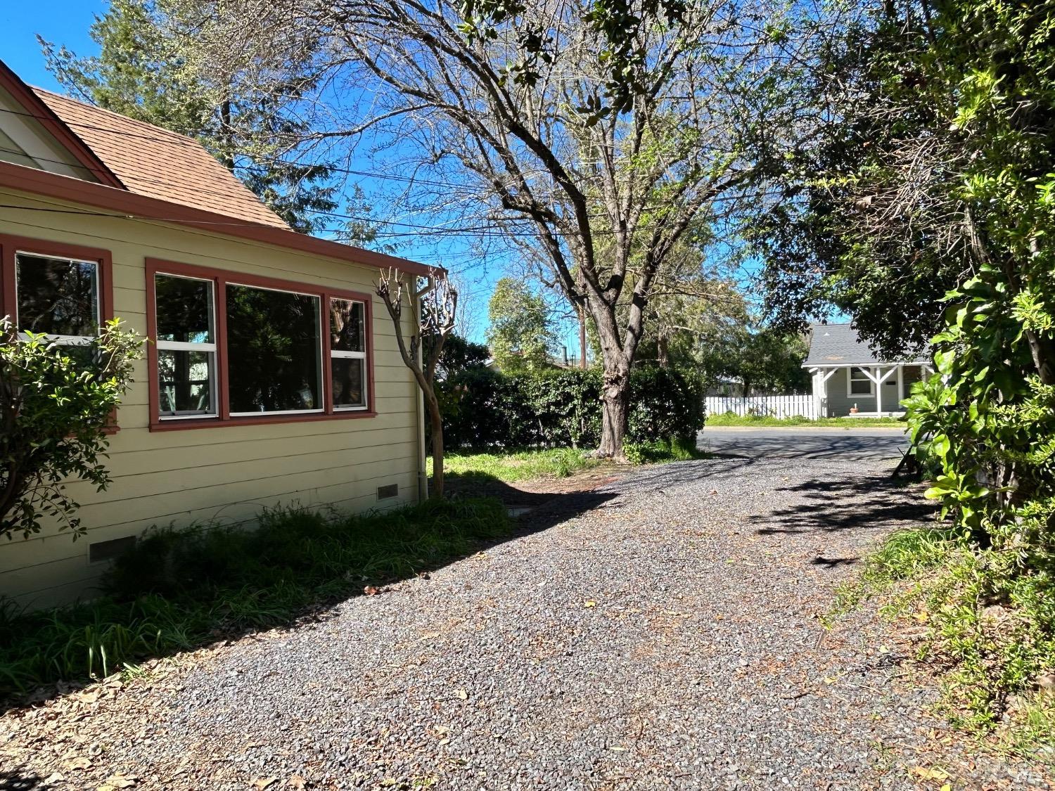 161 Cherry Street Ukiah, CA 95482 - Photo 35 of 39 a front view of a house with a garden and trees