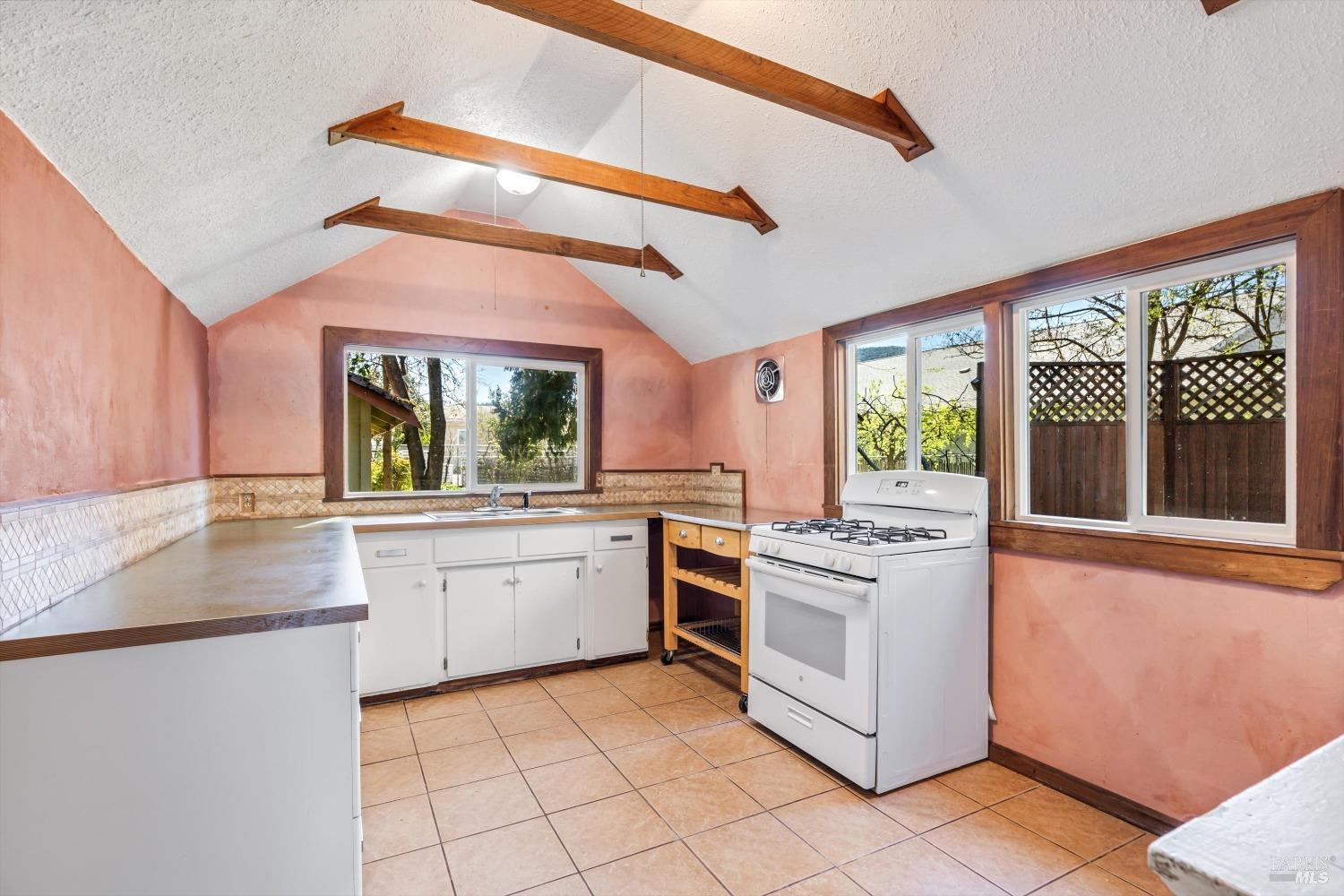 161 Cherry Street Ukiah, CA 95482 - Photo 8 of 39 a kitchen with a stove a sink and a refrigerator