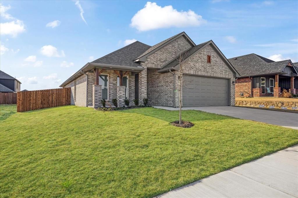 a front view of a house with yard