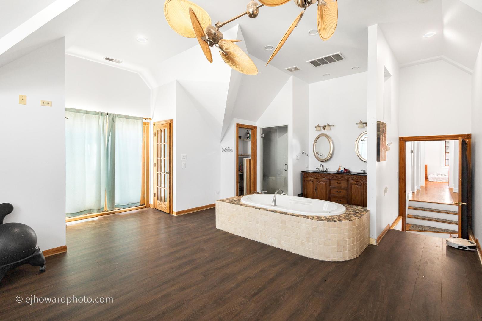 3655 Kent Place Crete, IL 60417 - Photo 14 of 29 a living room with a bed and a chandelier