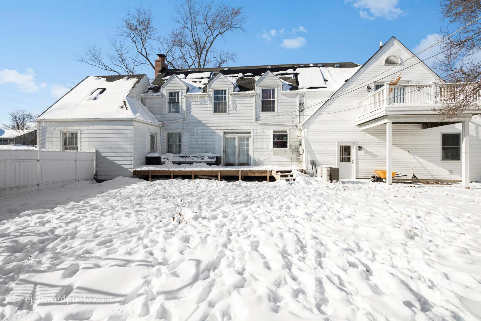 3655 Kent Place Crete, IL 60417 - Photo 20 of 29 a view of a white house with wooden fence