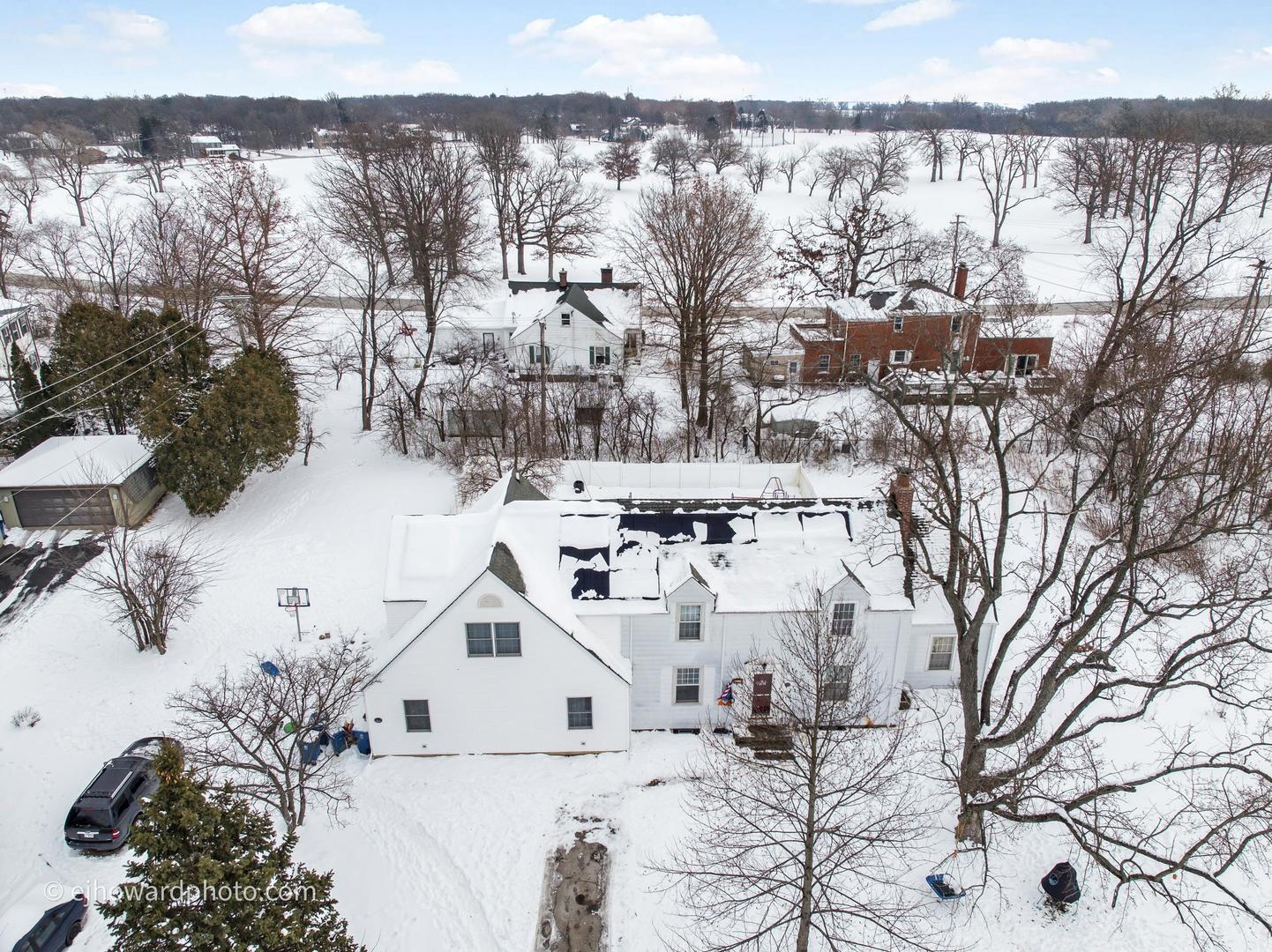 3655 Kent Place Crete, IL 60417 - Photo 22 of 29 a view of a house with a yard covered in snow