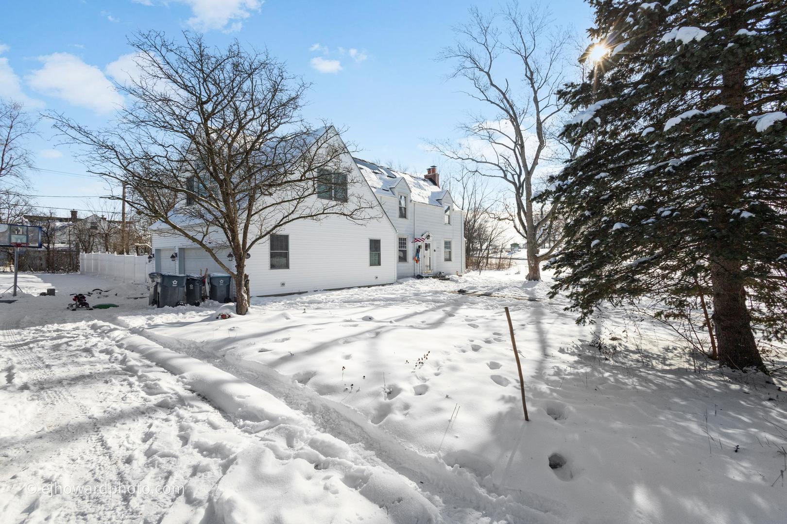 3655 Kent Place Crete, IL 60417 - Photo 3 of 29 a view of white house with snow on the road