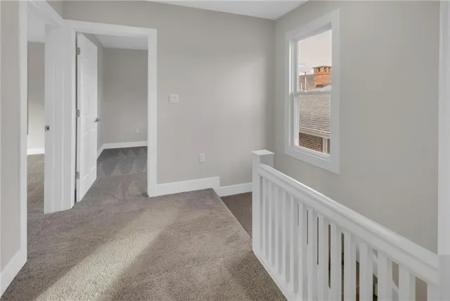 a view of a hallway with windows